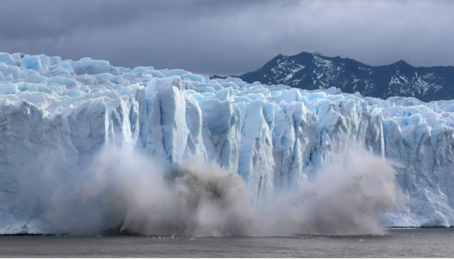 Glacier ice melting and falling into the ocean, contributing to the rising sea levels. (Source: Screenshot from NY Times, David Silverman/Getty Images)