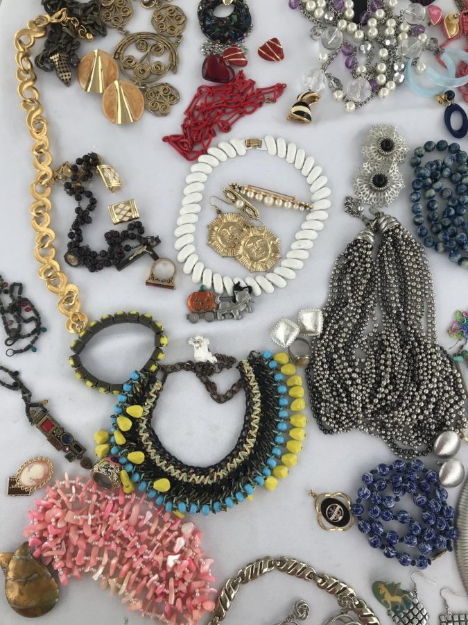 A full table covered with second hand jewelry. 