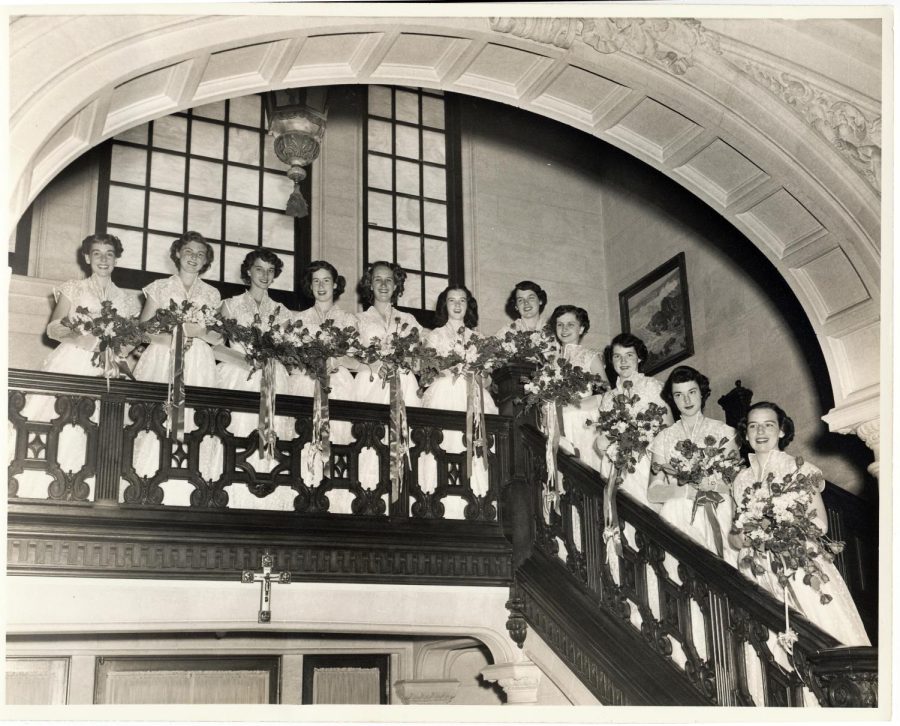 Graduating+Class+of+1951+on+the+steps+of+Strub+Hall+in+their+graduation+dresses.