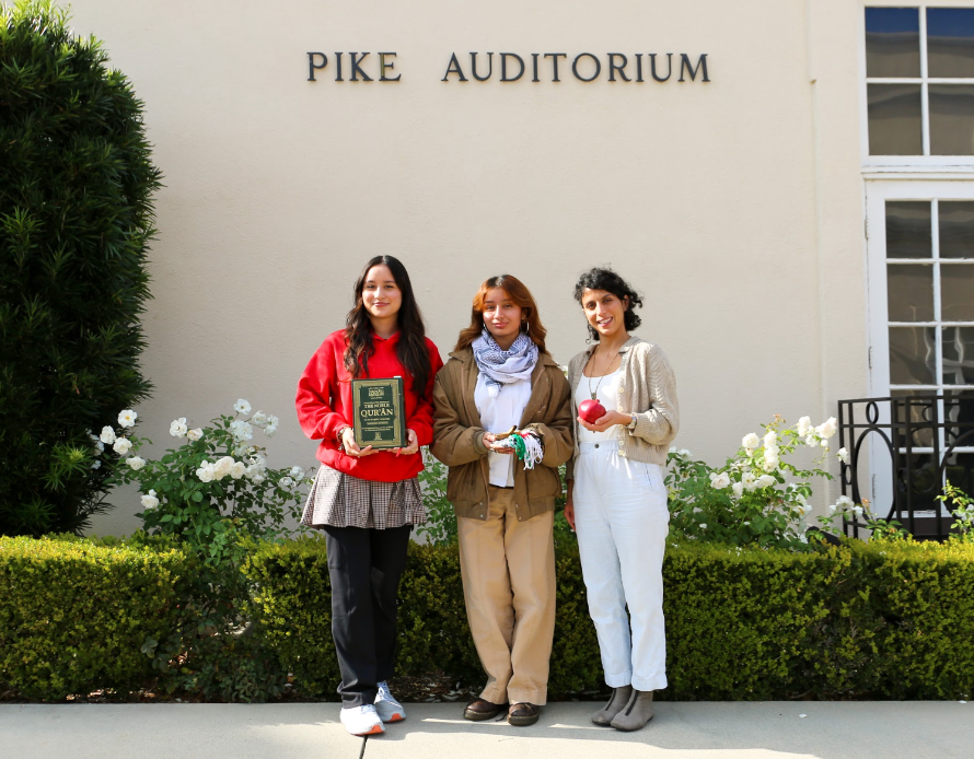 Jemimah Khan ‘24, Rubi Nasiyah Cedillo ‘24, and Jennifer Saparzadeh display the Quran, Palo Santo, and Pomegranate they offered as symbols of peace during the prayer service.  Photo credits: Mayfield Crier
