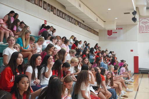Freshman at orientation in the gym right before an afternoon service activity. 
