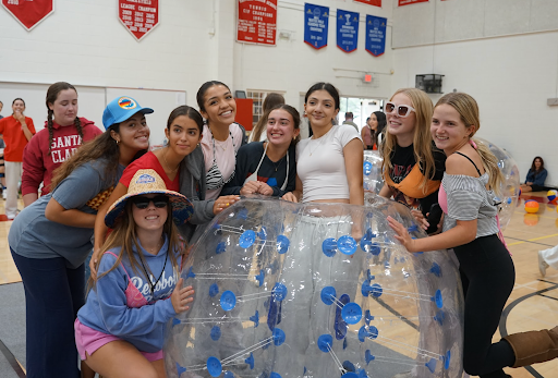 This photo was taken after Junior Nareh P won a game for the class of ‘27. 
From Left to right Maddy J, Phyllis K, Hope M, Haley M, Rowan S, Nareh P, Harper L, and Chloe L.
