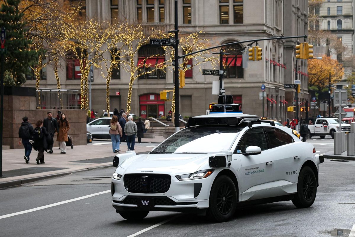 Waymo driverless taxi drives in lower Manhattan in New York City, U.S., November 26, 2025. REUTERS/Brendan McDermid