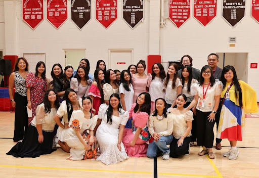 The Society of Philippine Americans at Mayfield (SPAM) posing for a photo in their cultural attire following the successful assembly. (Mayfield Crier)