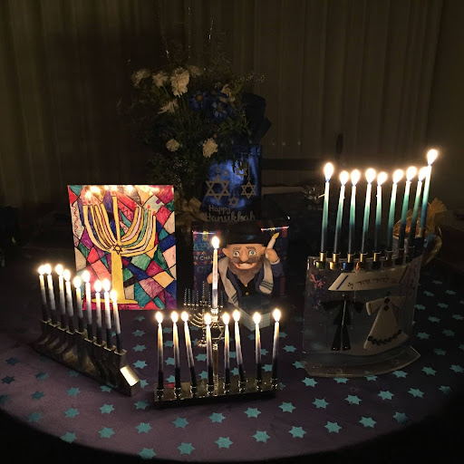 Menorahs glowing with pride on the final day of Hanukkah! 