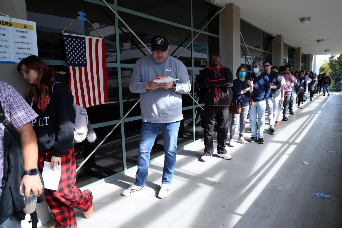 People stand in line to vote during the 2024 U.S. presidential election on Election Day at Pasadena City College in Pasadena, California, U.S., November 5, 2024. REUTERS/Mario Anzuoni