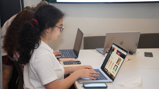 Lila Golden ‘29 works on a story for the Scholastic contest.
