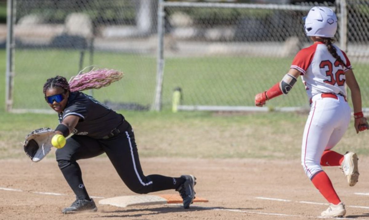 A Westridge player stretches for the out at second as Sarah Salazar runs into the play during the Cub’s win. 
