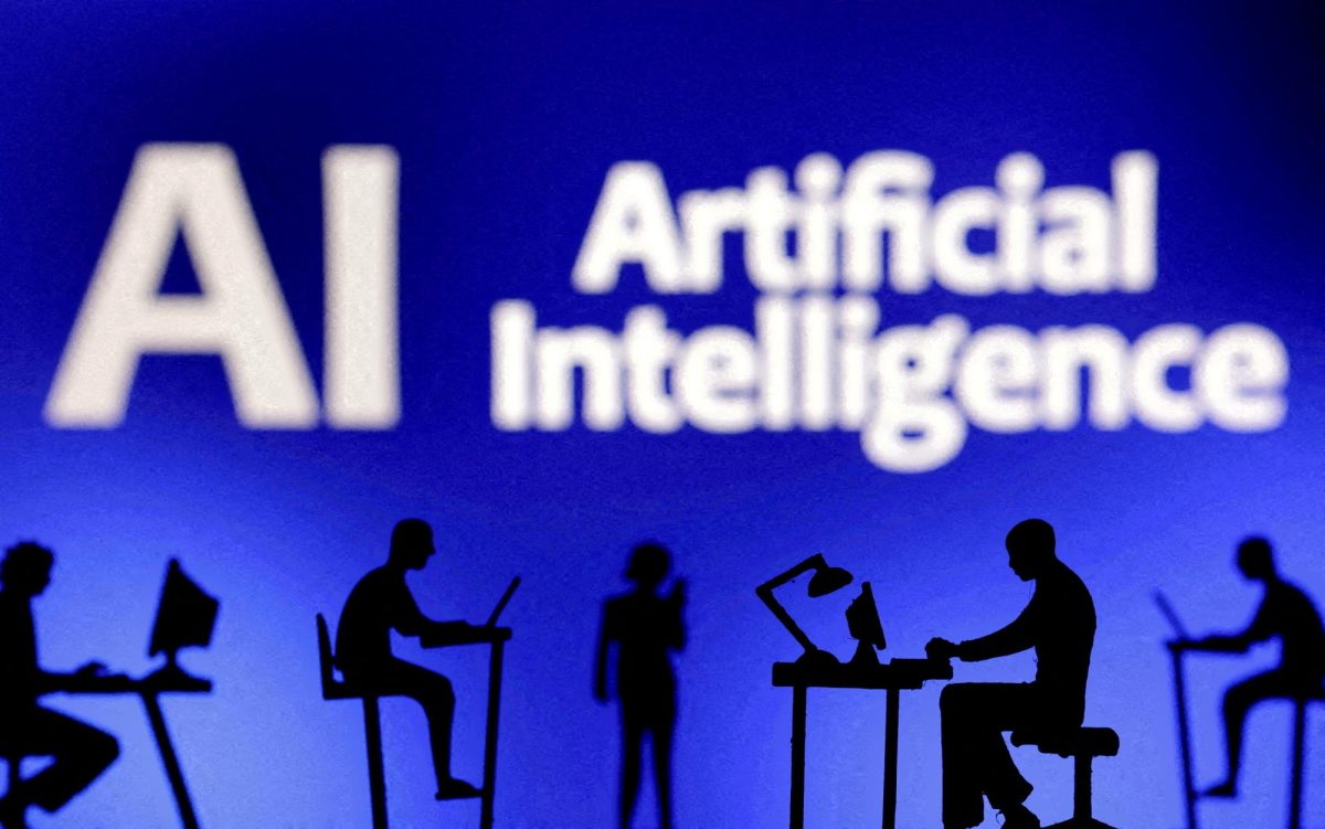 Figurines with computers and smartphones are seen in front of the words "Artificial Intelligence AI" in this illustration created on February 19, 2024. REUTERS/Dado Ruvic/Illustration