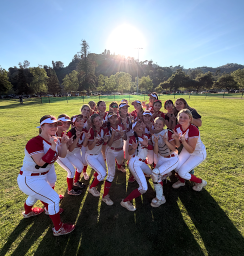 Mayfield's Softball team celebrates their win. Photo Credit: Mayfield Crier.